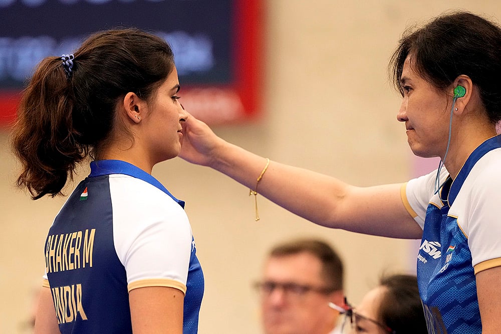Ravi Choudhary : Manu Bhaker being consoled by her coach after finishing fourth in the 25m Pistol Women’s Final